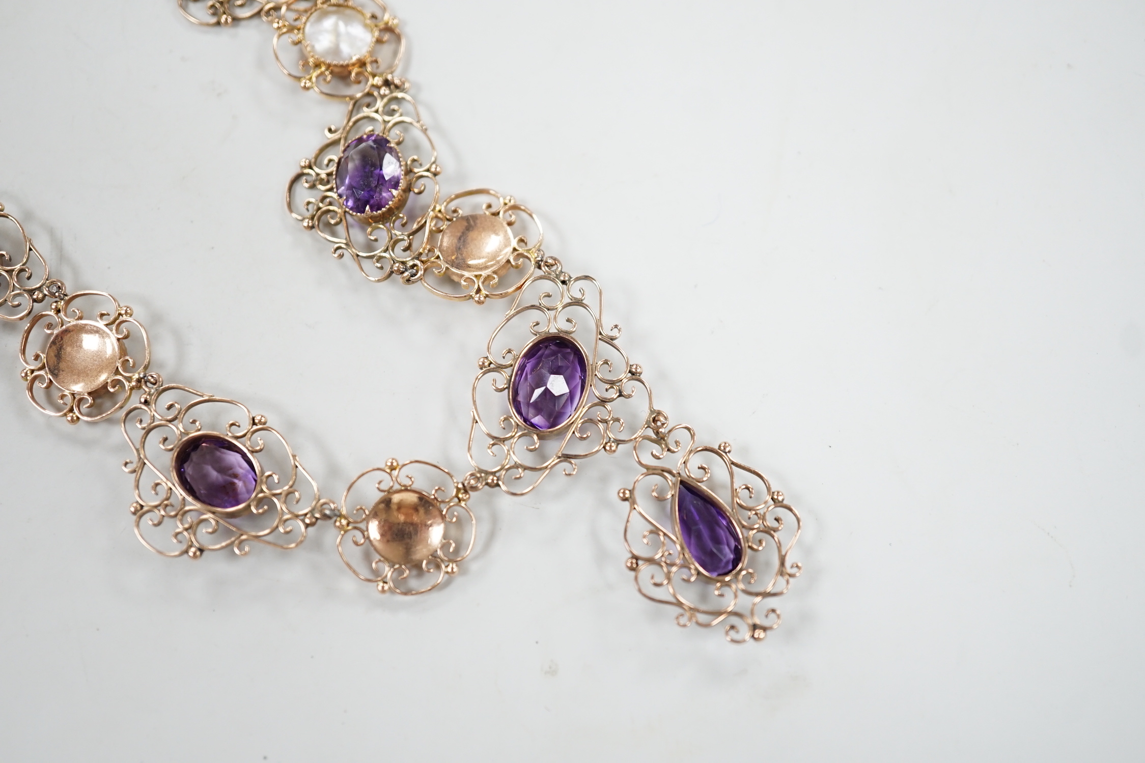 An Edwardian yellow metal, amethyst and mother-of-pearl set drop necklace, 44cm, gross weight 29.5 grams.